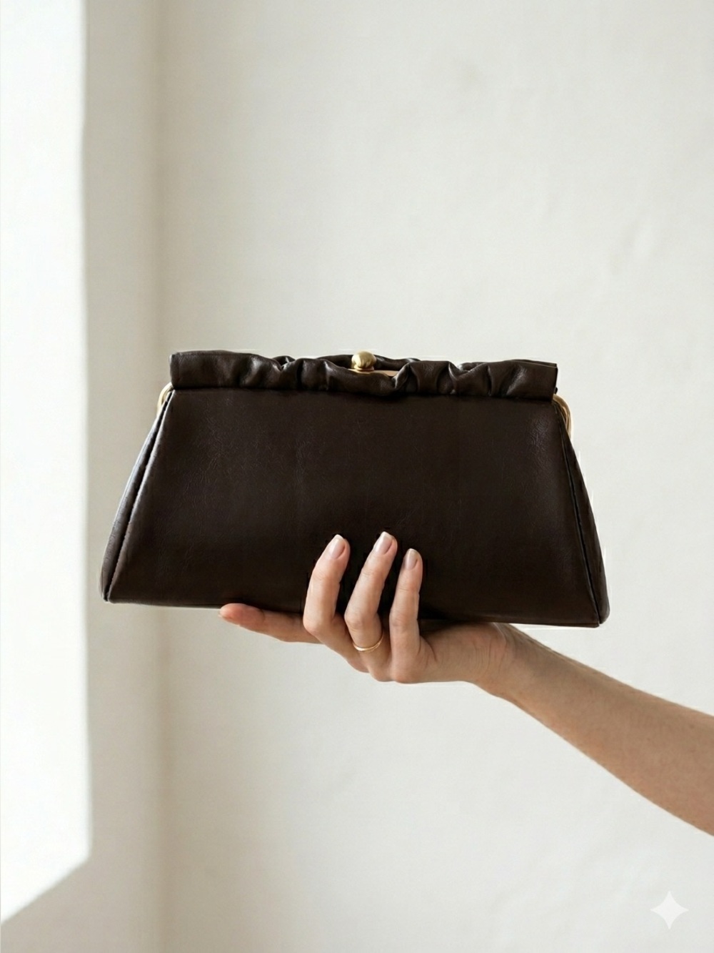 Vintage 1960s brown leather clutch bag with gold chain wristlet strap